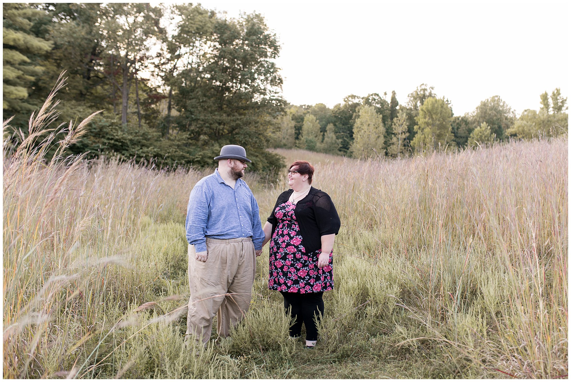 couple holds hand during Fort Harrison State Park engagement session in Indianapolis