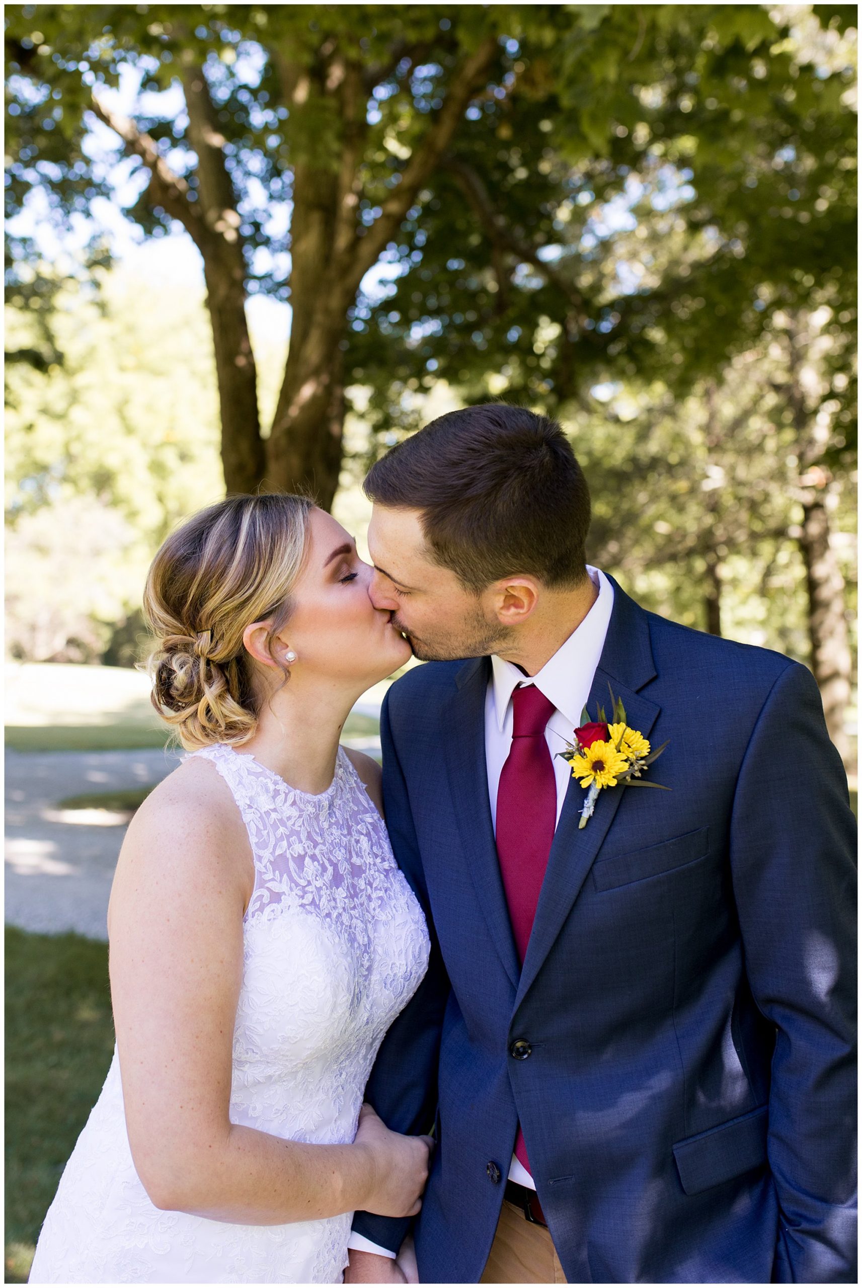 bride and groom kiss at Legacy Barn wedding venue in Kokomo Indiana