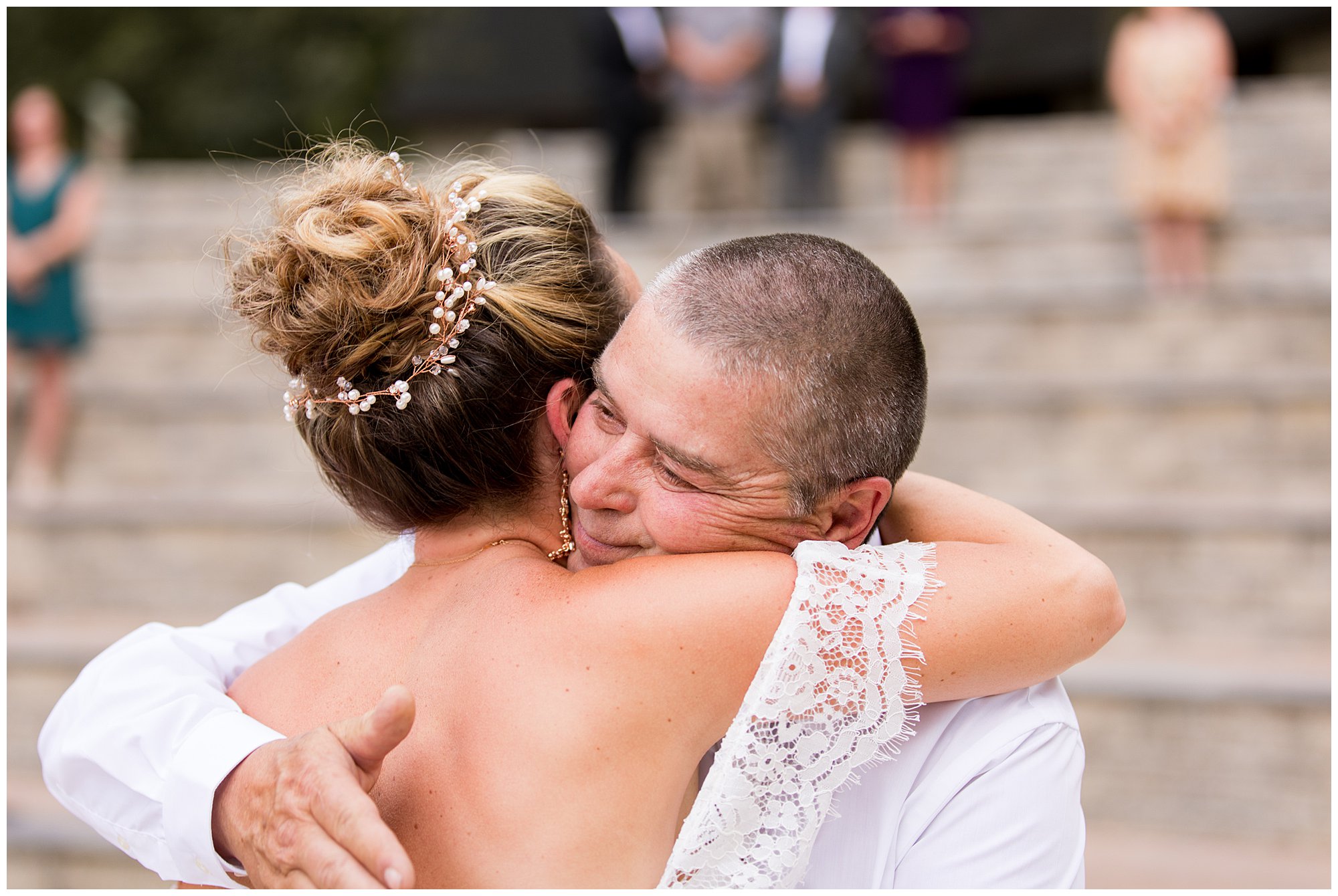 father of bride hugs bride before wedding ceremony begins in Warsaw Indiana