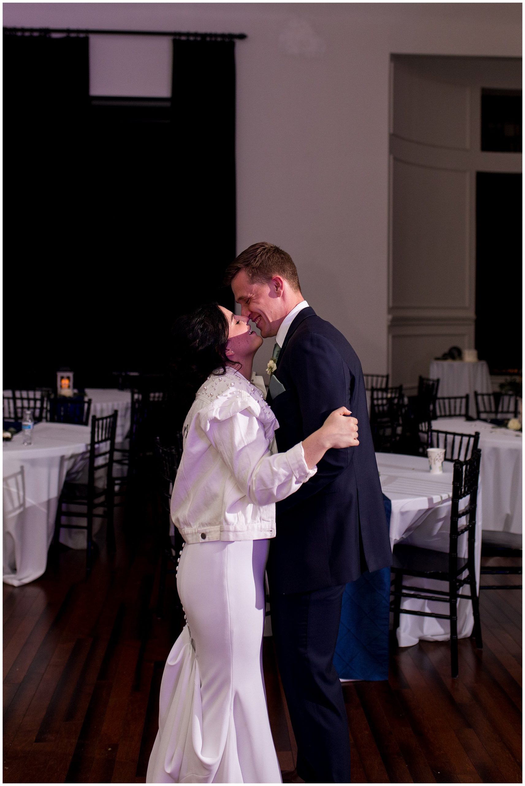 bride and groom kiss at The Hobson Kokomo wedding reception