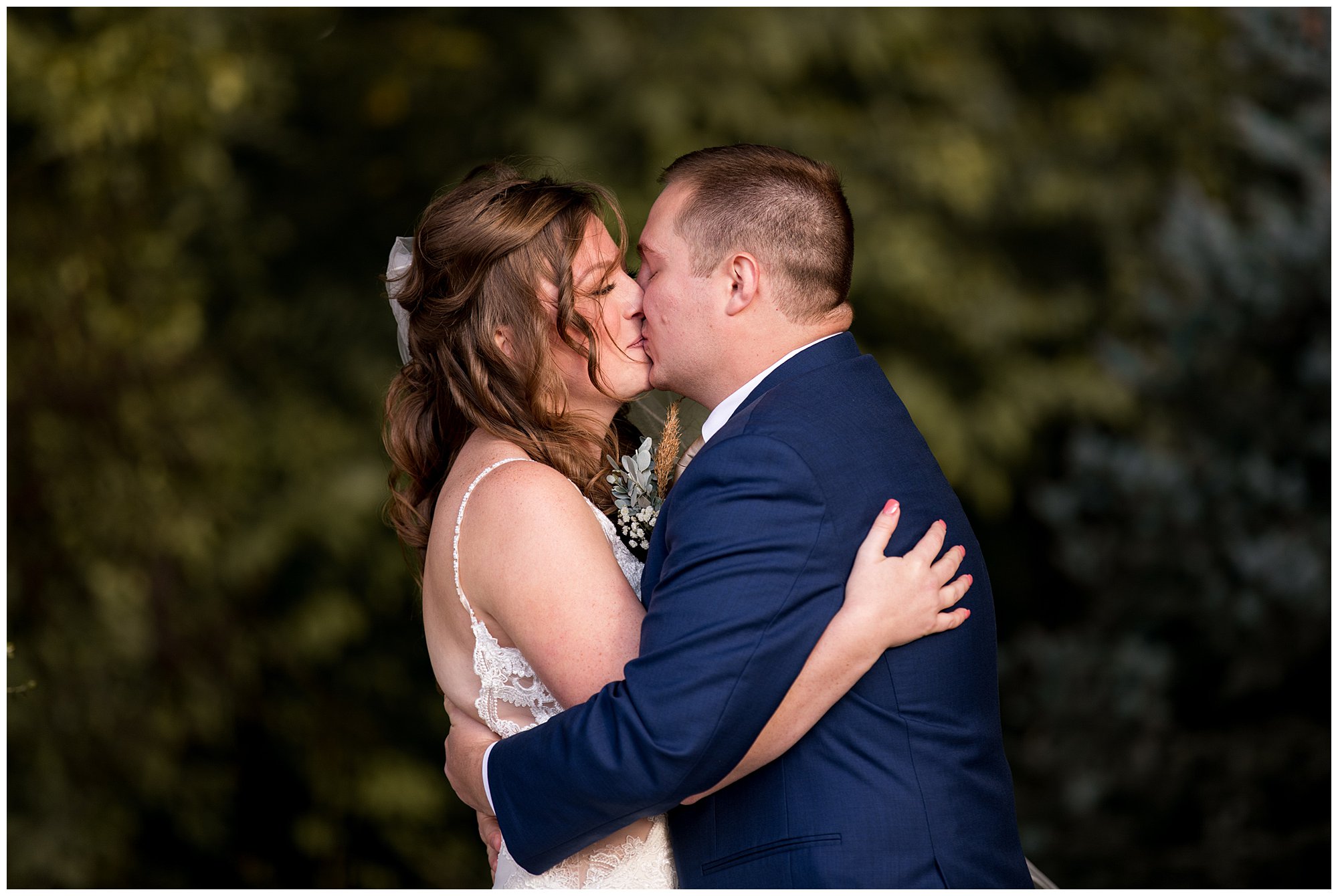 bride and groom have first kiss after wedding ceremony at Barn at Bay Horse Inn in Greenwood Indiana