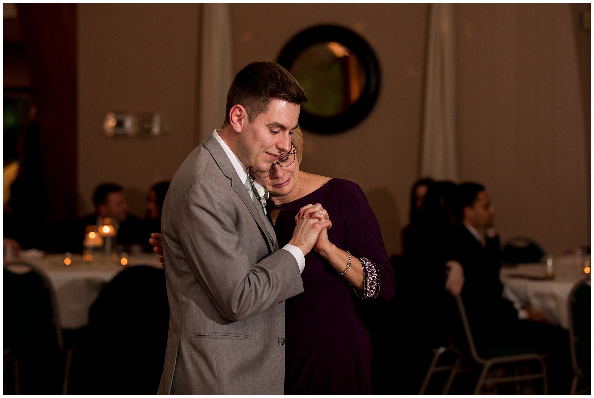 groom dances with mom at wedding reception at Lighted Gardens